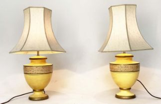 TABLE LAMPS, a pair, yellow ceramic of urn form with Italian script and pagoda silk shades, 67cm