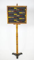 ABACUS, 146cm H x 51cm W, 19th century ash and polychrome with iron base.