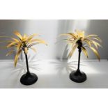 PALM TREE CANDLESTICKS, a pair, 46cm high, gilt palm leaves, black stands. (2)