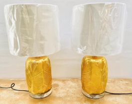 TABLE LAMPS, 50cm high, 30cm diameter, a pair, banana leaf design, gilt finish. (2)