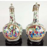 BOTTLE VASES, a pair, Chinese famille rose, with carved hardwood bases and covers, 41cm H. (2)