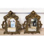 MIRRORED WALL SCONES, a pair, Continental, early 20th century brass with shaped distressed mercury