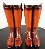 FAUX RIDING BOOTS STICK STANDS, a pair, polychrome resin, 48cm H. (2)