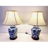 TABLE LAMPS, a pair, 61cm high, Chinese export style blue and white ceramic, with shades. (2)