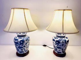 TABLE LAMPS, a pair, 61cm high, Chinese export style blue and white ceramic, with shades. (2)