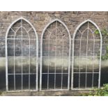 ARCHITECTURAL GARDEN FRAMES, a set of three, 160cm high, 67cm wide, Gothic style, aged metal. (3)