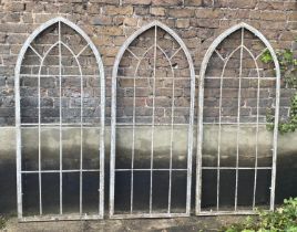 ARCHITECTURAL GARDEN FRAMES, a set of three, 160cm high, 67cm wide, Gothic style, aged metal. (3)