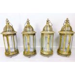 LANTERNS, a set of four, 61cm H x 21cm diameter, gilt metal frames and glazed. (4)