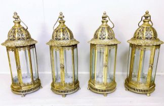 LANTERNS, a set of four, 61cm H x 21cm diameter, gilt metal frames and glazed. (4)