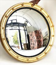 CONVEX WALL MIRROR, Regency style giltwood with convex mirror plate, ebonised reeded slip and ball