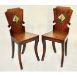 HALL CHAIRS, a pair, Regency mahogany each heraldic panelled back and sabre front supports, 39cm