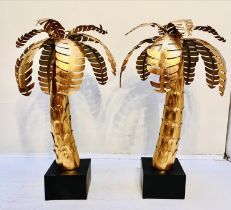 MAISON JANSEN STYLE PALM TREES, 65cm high, 40cm diameter, a pair, gilt metal finish. (2)