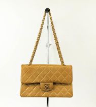 CHANEL VINTAGE FLAP BAG, with front flap closure and iconic interlocking CC lock, leather and