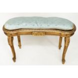 WINDOW SEAT, early 20th century French transitional style giltwood of kidney form with cane seat and