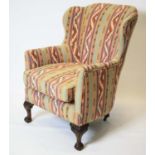 WING ARMCHAIR, 103cm H x 73cm, Georgian revival in geometric upholstery on rear castors.