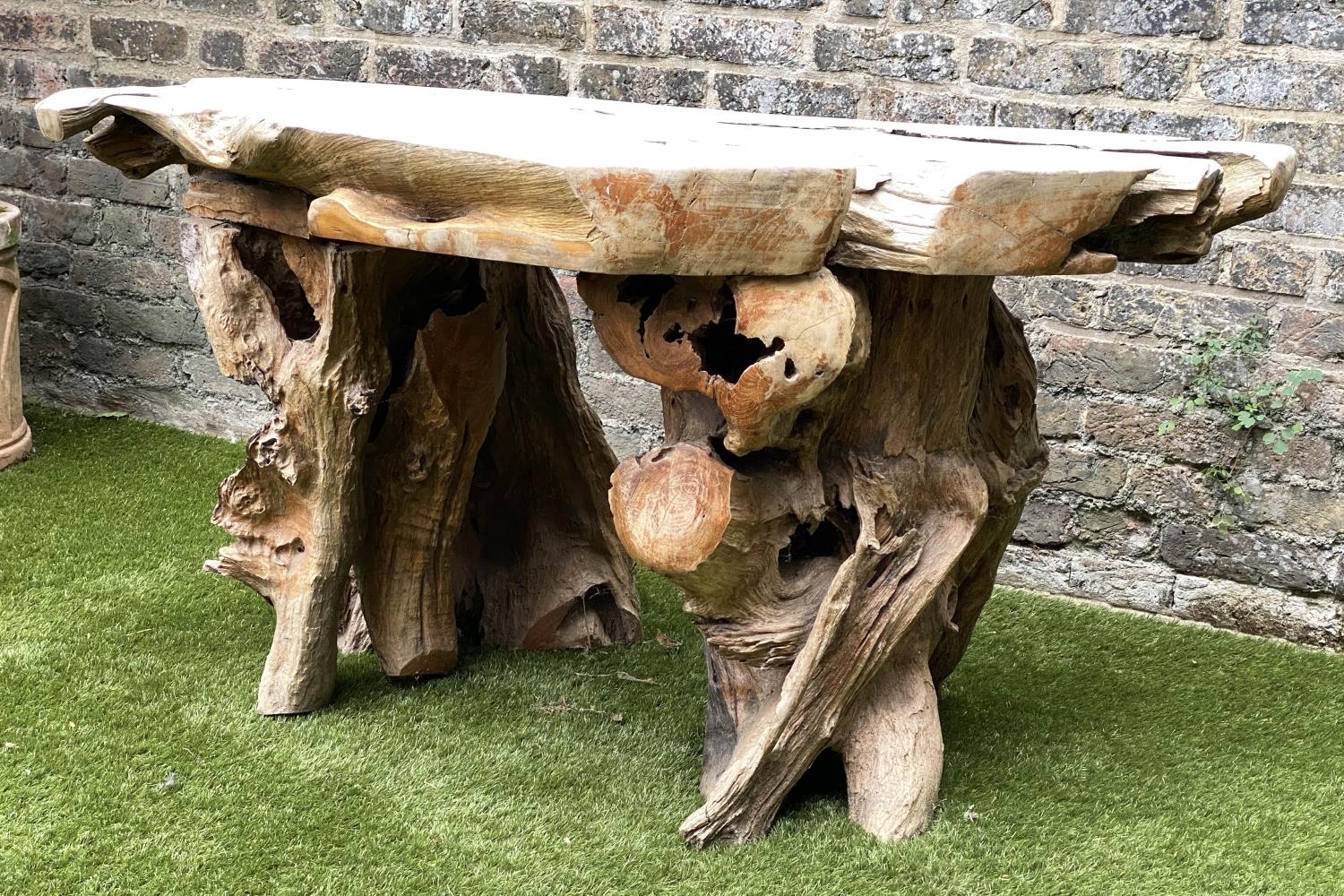 GARDEN 'ROOT' TABLE, well weathered tree section with raw edge and knarled root base, 136cm W x 66cm - Image 4 of 4