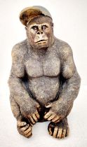 GORILLA WEARING A BASEBALL CAP, 60cm H x 40cm W x 34cm D, faux bronze finished resin.