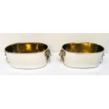 CHAMPAGNE COOLERS, a pair, 16cm high, 45cm wide, 26cm deep, lion head ring handles, silver plated