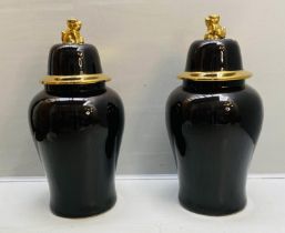 TEMPLE JARS WITH COVERS, 82cm high, 39cm diameter, black glazed ceramic, gilt detail. (2)