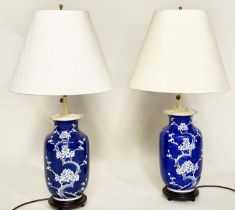 TABLE LAMPS, a pair, Chinese white on deep blue ceramic, vase form, adjustable height with wooden