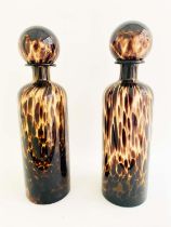 DECANTERS, a pair, 40cm high, 10cm diameter, Murano style tortoiseshell glass. (2)