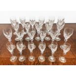 ATLANTIS CUT GLASSES, comprising eleven wine glasses, six white wine glasses and six sherry glasses.
