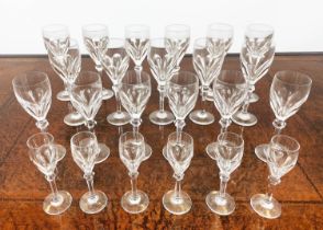 ATLANTIS CUT GLASSES, comprising eleven wine glasses, six white wine glasses and six sherry glasses.