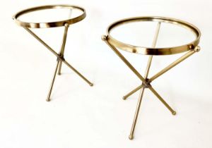 SIDE TABLES, a pair, 55cm high, 42cm diameter, glass inset tops, gilt metal triform supports. (2)