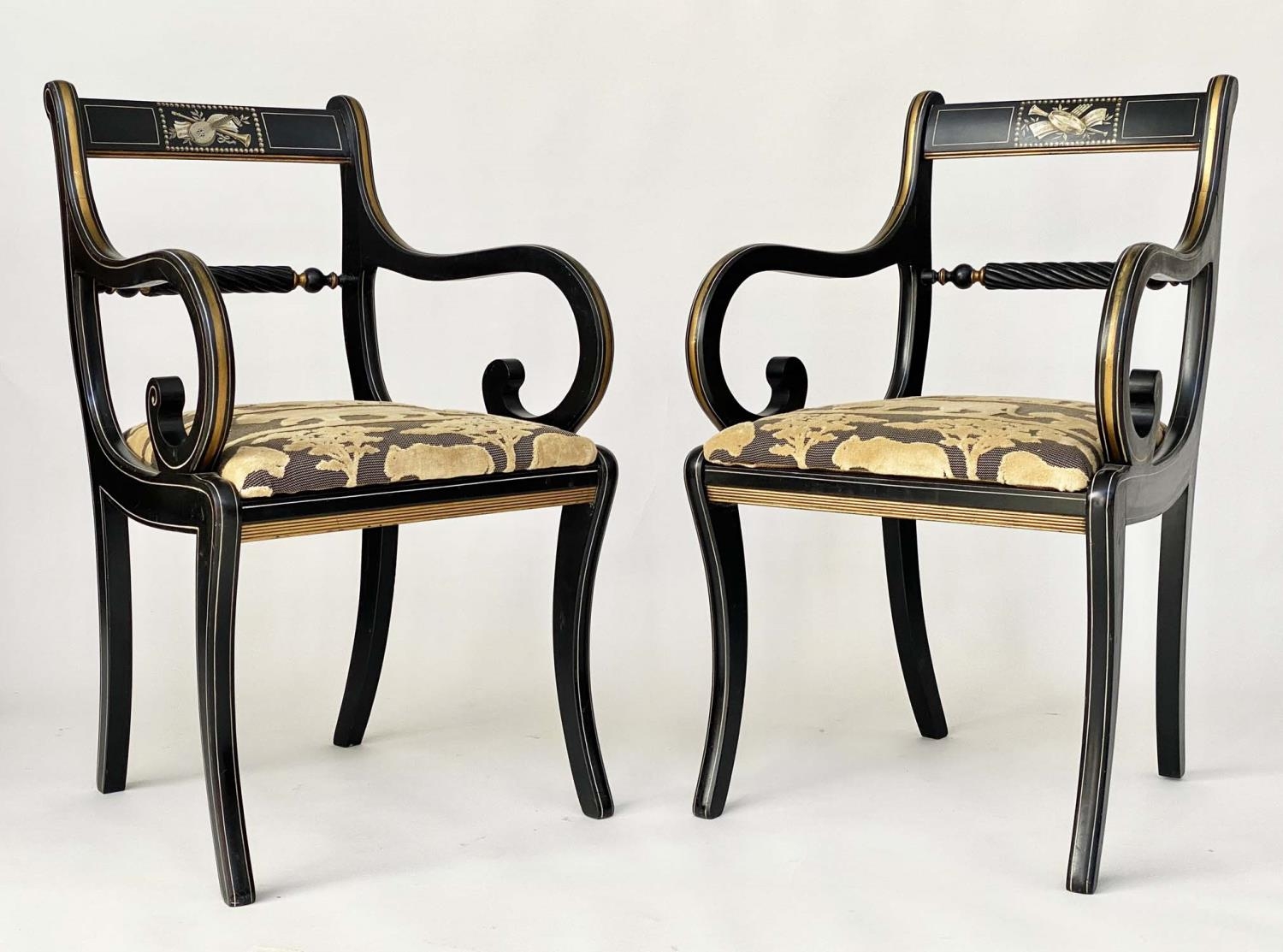 ELBOW CHAIRS, a pair, Regency design, lacquered and gilt with Andrew Martin 'Safari', fabric