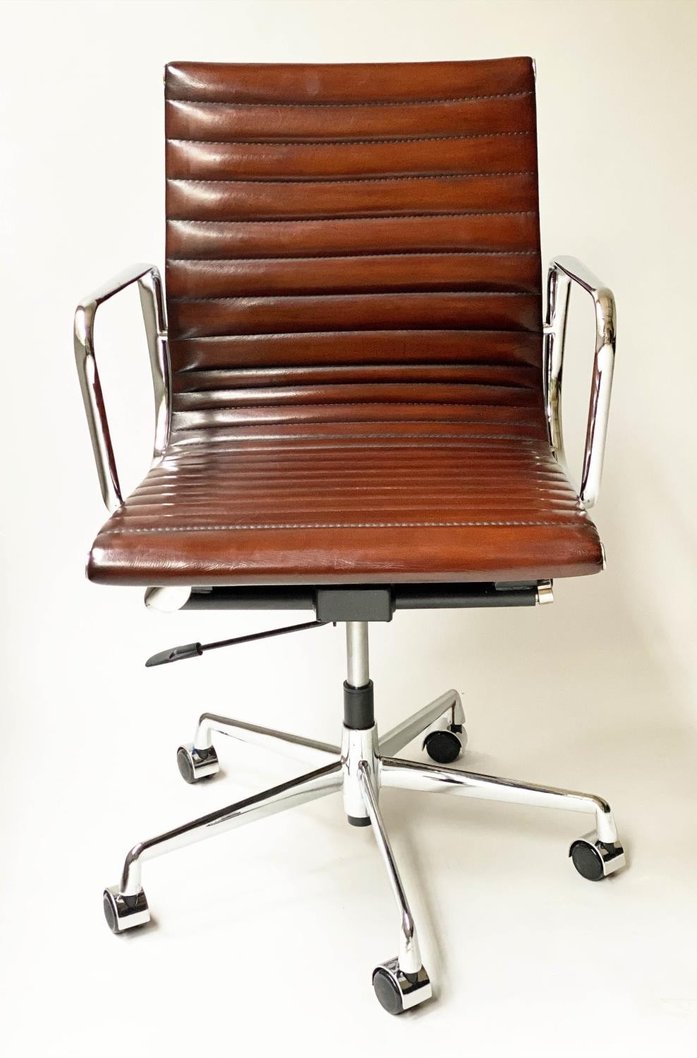 REVOLVING DESK CHAIR, Charles and Ray Eames inspired with ribbed mid brown leather seat revolving - Image 2 of 8