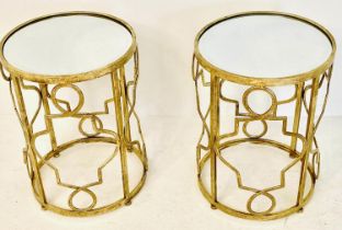 SIDE TABLES, a pair, 56cm high, 46cm diameter, gilt metal, inserted mirrored tops. (2)
