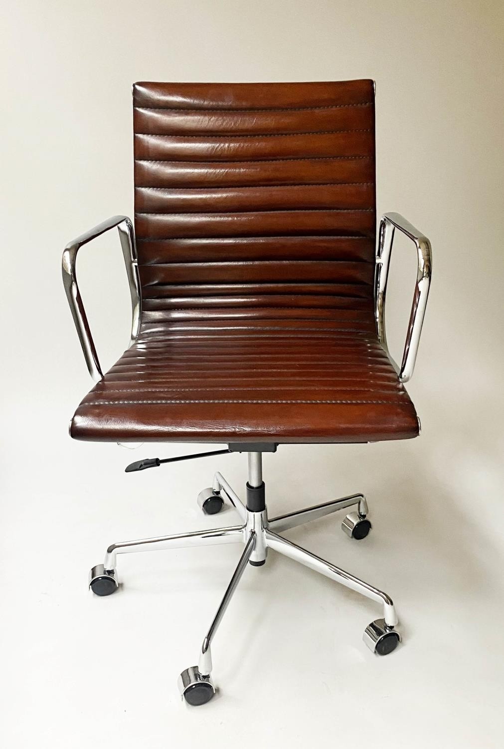 REVOLVING DESK CHAIR, Charles and Ray Eames inspired with ribbed mid brown leather seat revolving - Image 8 of 8