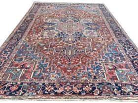 ANTIQUE PERSIAN HERIZ CARPET, 345cm x 246cm.