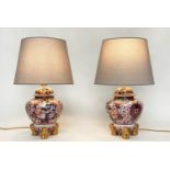 TABLE LAMPS, a pair, Imari design ceramic of lidded vase form with Dogs of Foo gilt supports (with