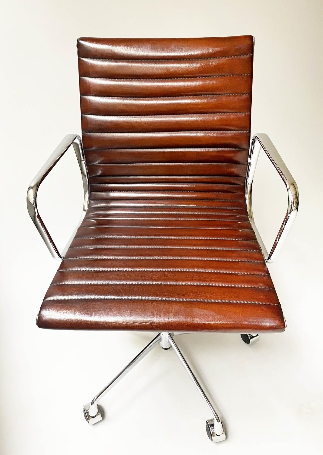 REVOLVING DESK CHAIR, Charles and Ray Eames inspired with ribbed mid brown leather seat revolving - Image 6 of 8