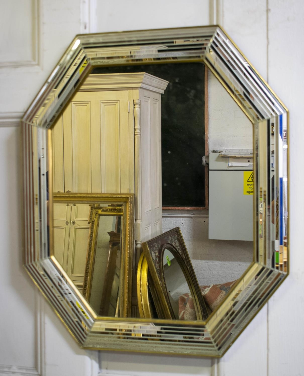 WALL MIRROR, 78cm H x 67cm, 20th century elongated octagonal gilt frame with strip plate cushion