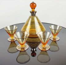 VINTAGE AMBER COCKTAIL DECANTER with four glasses, with a number '16', on the base of the decanter