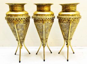 VASES ON STANDS, set of three, tapered form, textured gilt metal, 58cm high, 22cm diameter. (3)