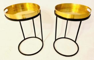 TRAY TABLES, a pair, 51cm high x 40cm diam, the gilt metal trays raised on black painted metal