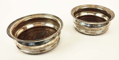 SILVER DECANTER COASTERS, a pair, George III style, London 1973, makers mark for CJ Vander Ltd,