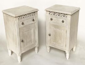 BEDSIDE CABINETS, a pair, French traditionally grey painted with drawer, panelled door and pierced