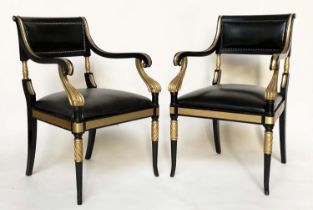 ARMCHAIRS, a pair, Regency style lacquered and gilded with leather seats scroll arms and swept front