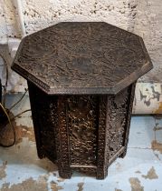 OCCASIONAL TABLE, Anglo-Indian octagonal form, foliage carved top and pierced folding base, 49cm H x