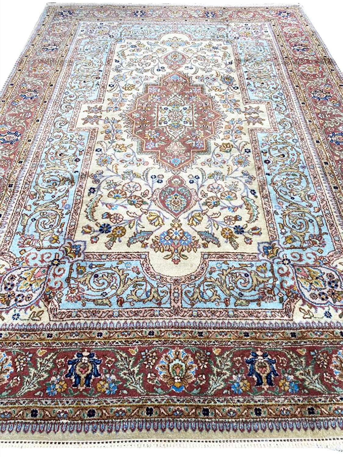 ANTIQUE PERSIAN TABRIZ CARPET, 295cm x 200cm.