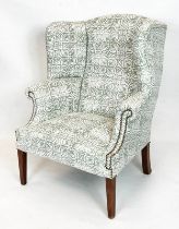 WING ARMCHAIR, 106cm H x 87cm, early 20th century mahogany in white and green patterned fabric.