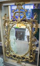 WALL MIRROR, 158cm H x 85cm, 18th century style giltwood with foliate carved frame.