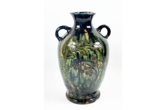 C.H. BRANNAM BURUMWARE POTTERY VASE, incised decoration of leaves and berries in blue, green, - Image 1 of 6