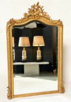 WALL MIRROR, 19th century French giltwood and gesso moulded with arched bevelled plate and 'C'