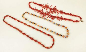 A RED CORAL DOUBLE STRAND NECKLACE, 36cm long, a carnelian single strand bead necklace, 64cm long,