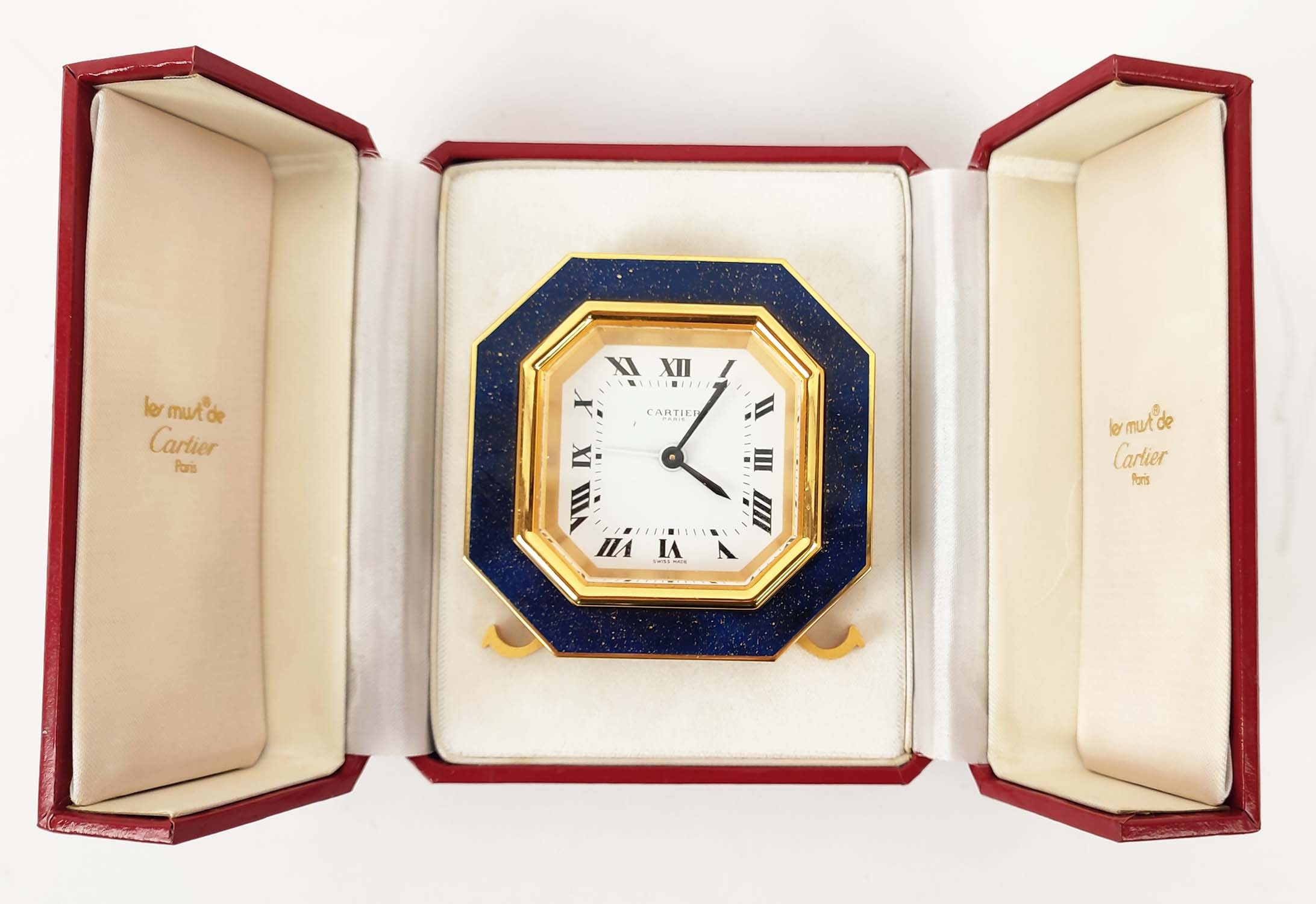 A CARTIER TRAVELLING CLOCK, simulated lapis lazuli enameled gilt octagonal case, white dial with - Image 14 of 19